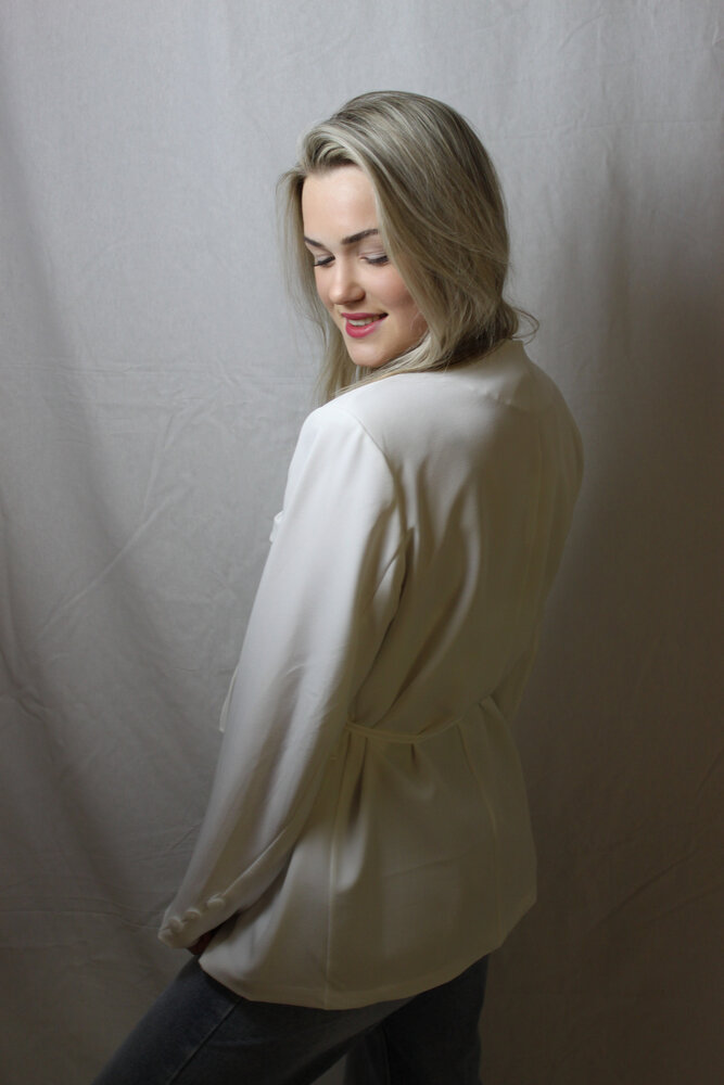 White blazer tied