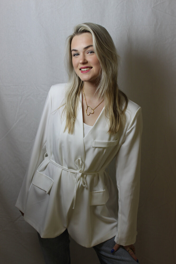 White blazer tied