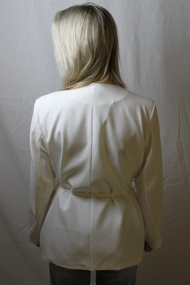 White blazer tied